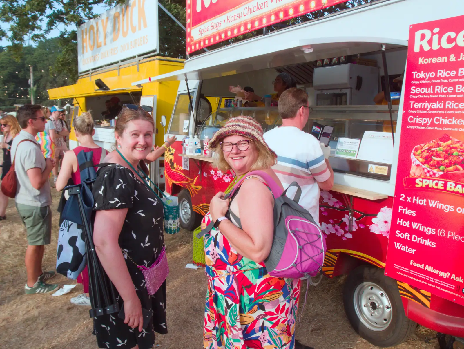 Isobel and Megan stop for some food, from Latitude's Twentieth Edition, Henham Park, Suffolk - 25th July 2026