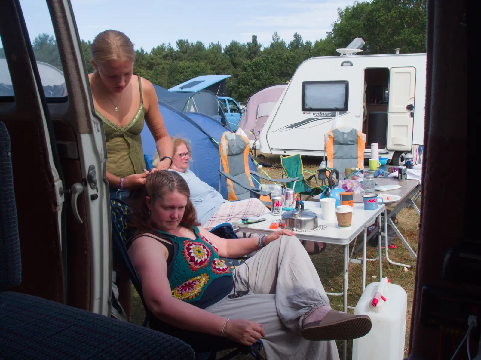 Alice plaits Isobel's hair, from Latitude's Twentieth Edition, Henham Park, Suffolk - 25th July 2026