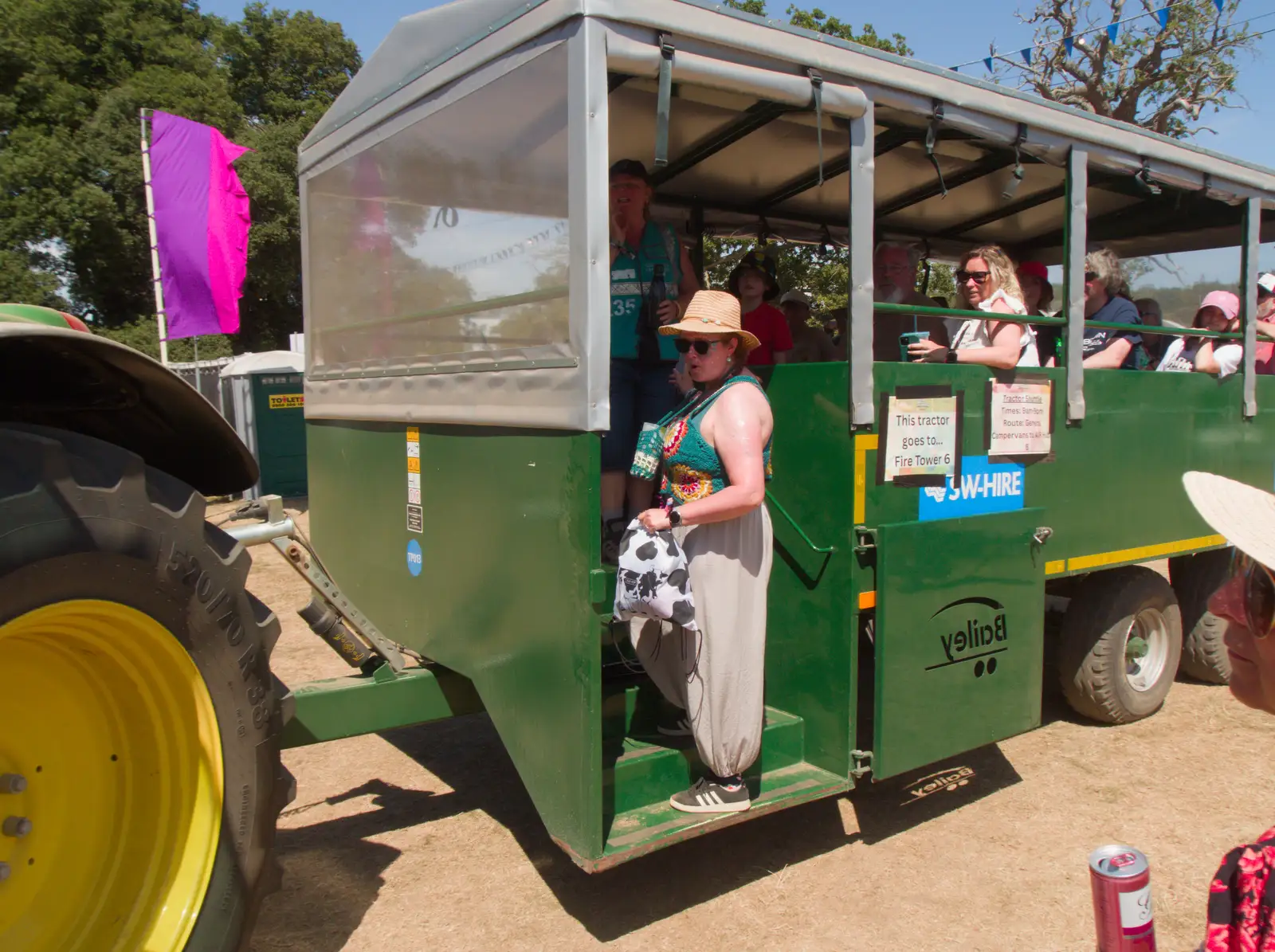 Isobel negotiates the last spot on the tractor, from Latitude's Twentieth Edition, Henham Park, Suffolk - 25th July 2026
