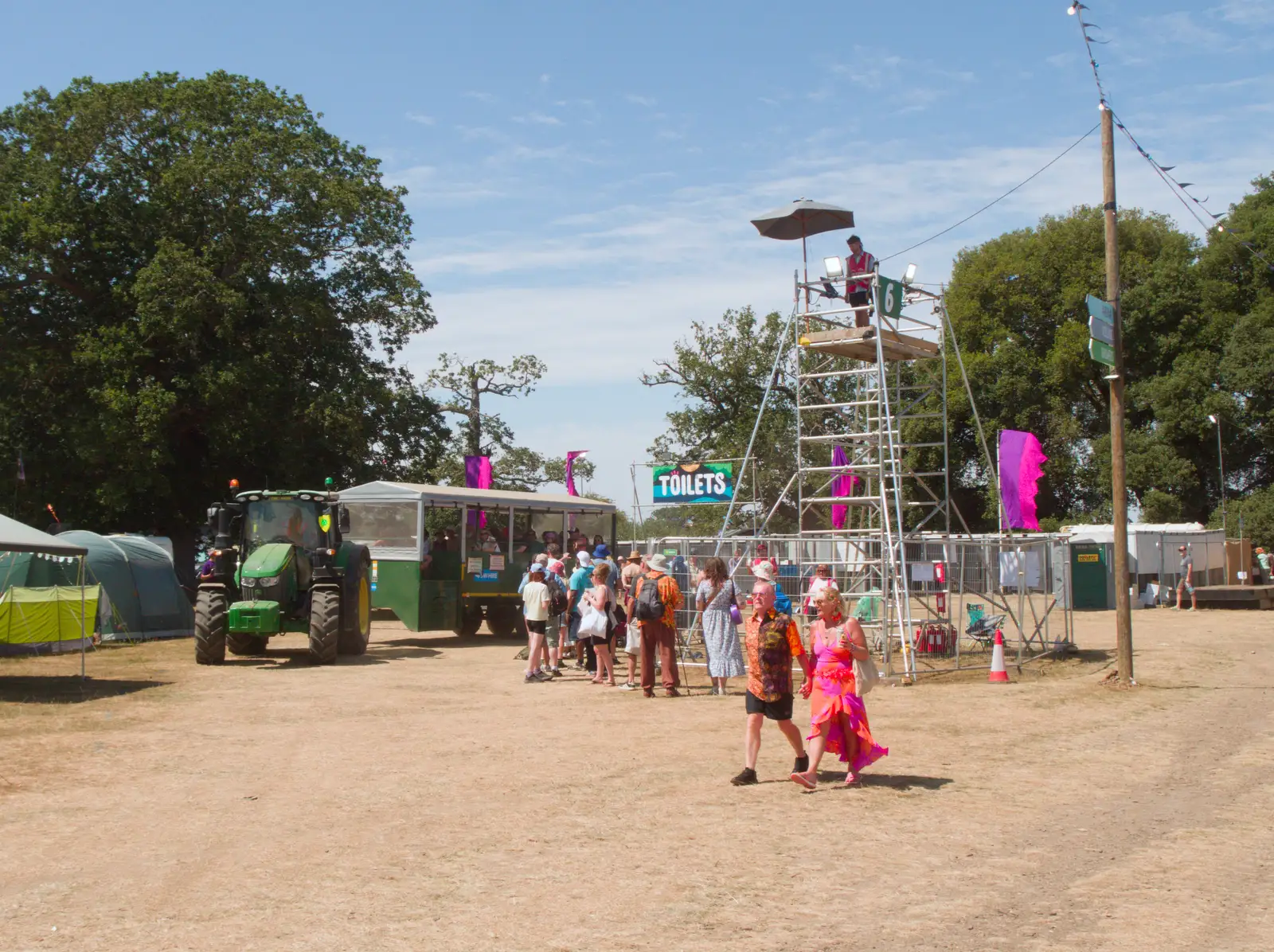 The tractor heads off for another taxi run, from Latitude's Twentieth Edition, Henham Park, Suffolk - 25th July 2026