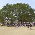 People cling to the shade offered by the tree, Latitude's Twentieth Edition, Henham Park, Suffolk - 25th July 2026
