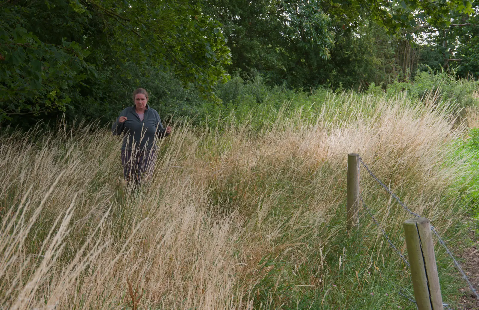 Isobel fights her way through the long grass, from A July Miscellany: Scole and a Ride To Pulham, Norfolk - 30th July 2026