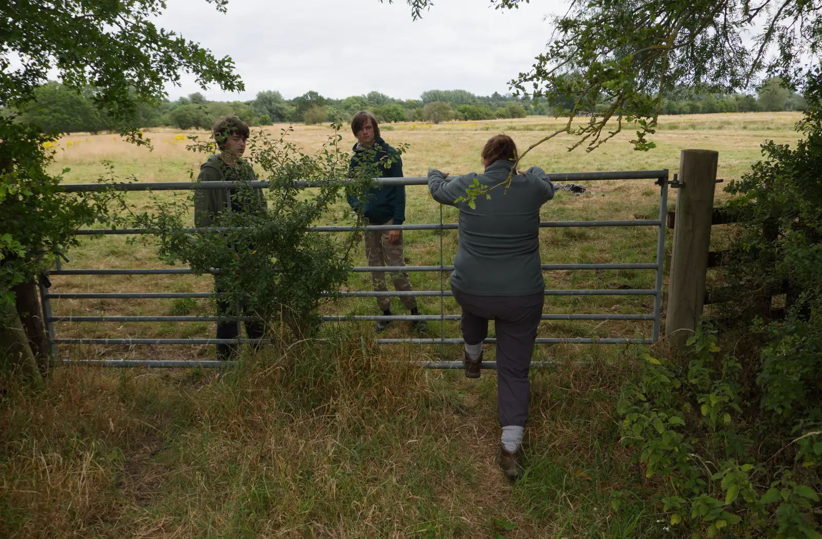 Isobel climbs over a gate, from A July Miscellany: Scole and a Ride To Pulham, Norfolk - 30th July 2026