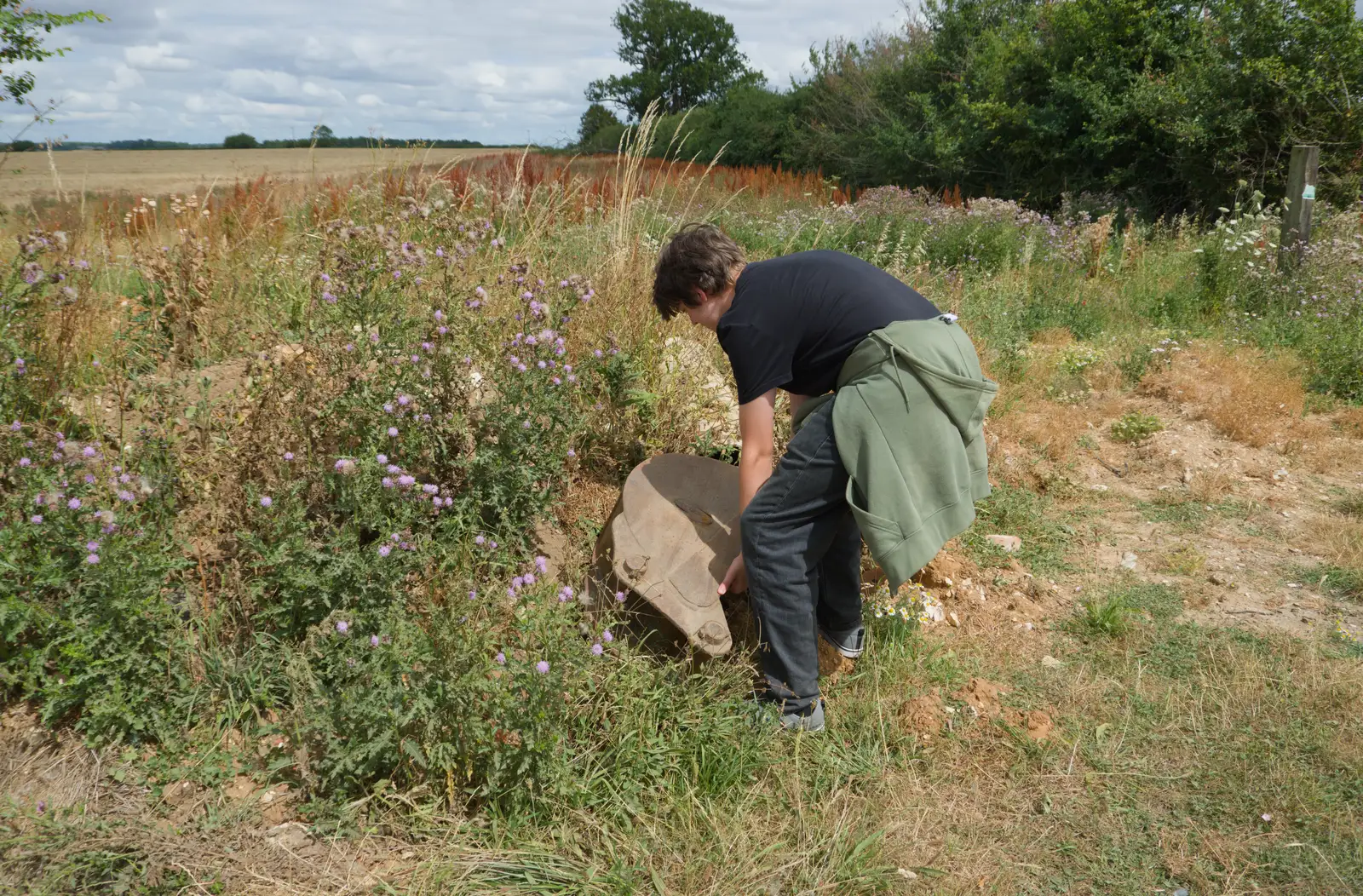 Fred tries to pick up a discarded digger bucket, from A July Miscellany: Scole and a Ride To Pulham, Norfolk - 30th July 2026