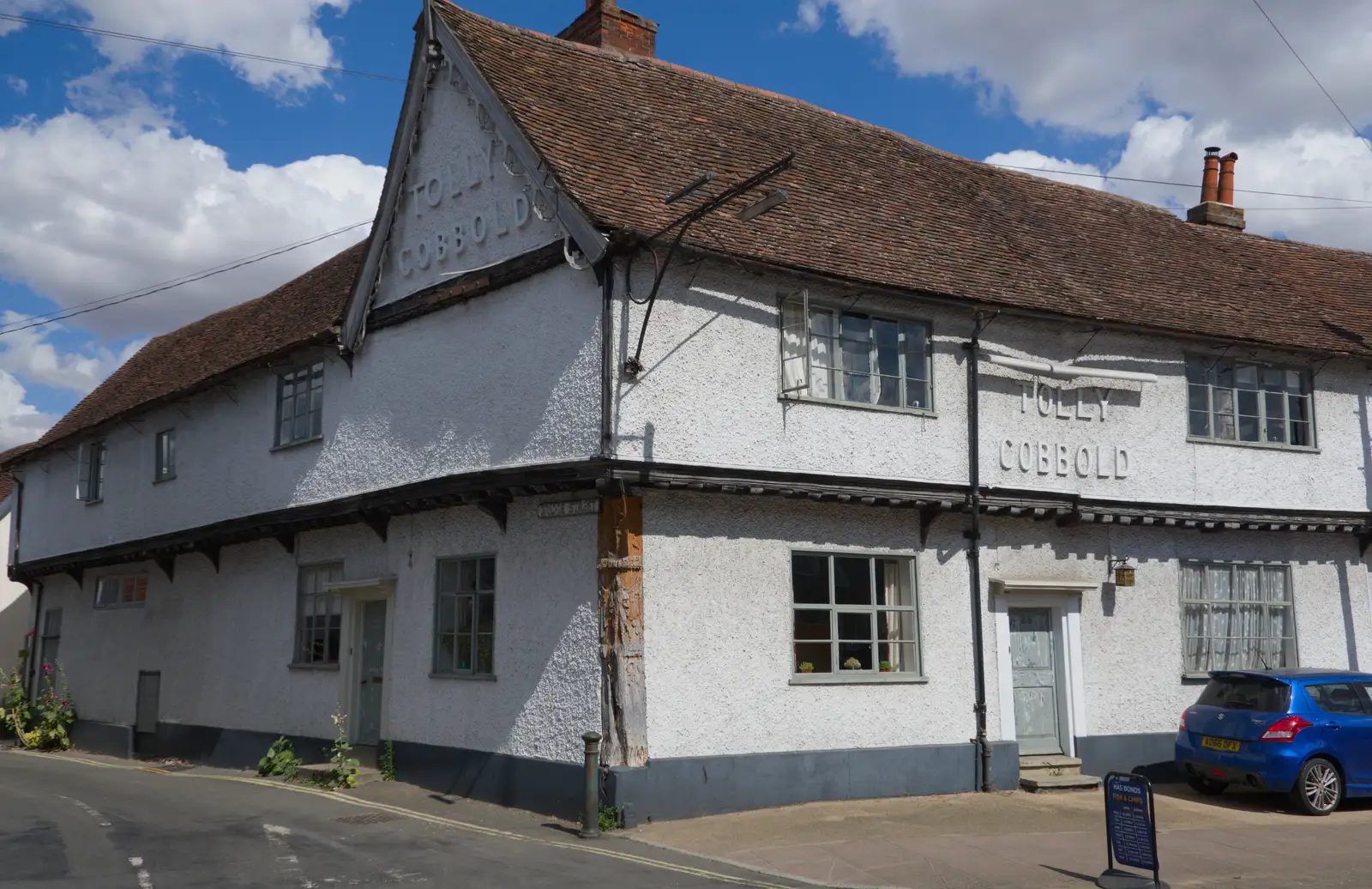 A former pub with Tolly Cobbold signs on it, from A Postcard From: Needham Market, Suffolk - 31st July 2026