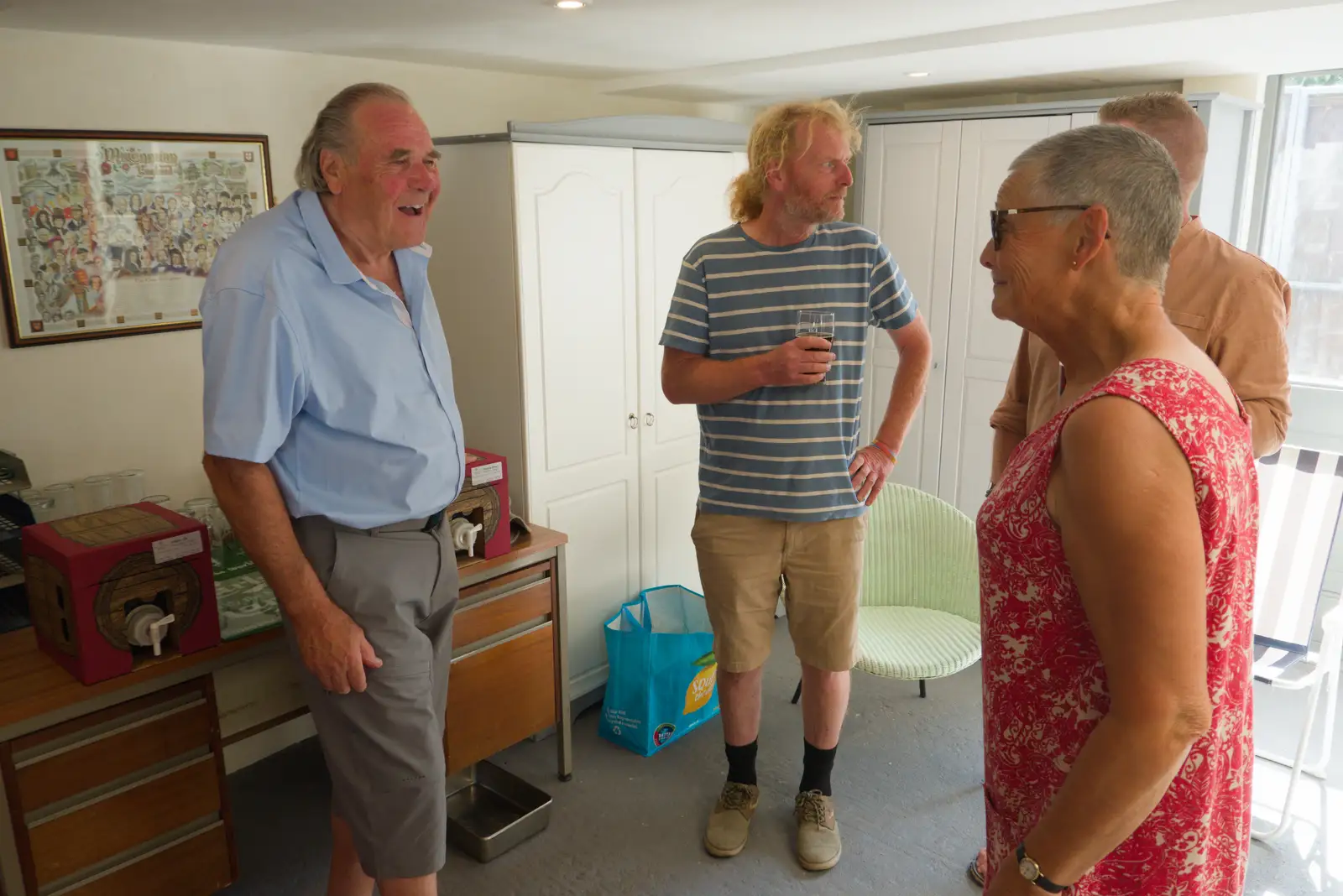 Alan's found something amusing, from Alan's 80th Birthday, Eye, Suffolk - 8th August 2026