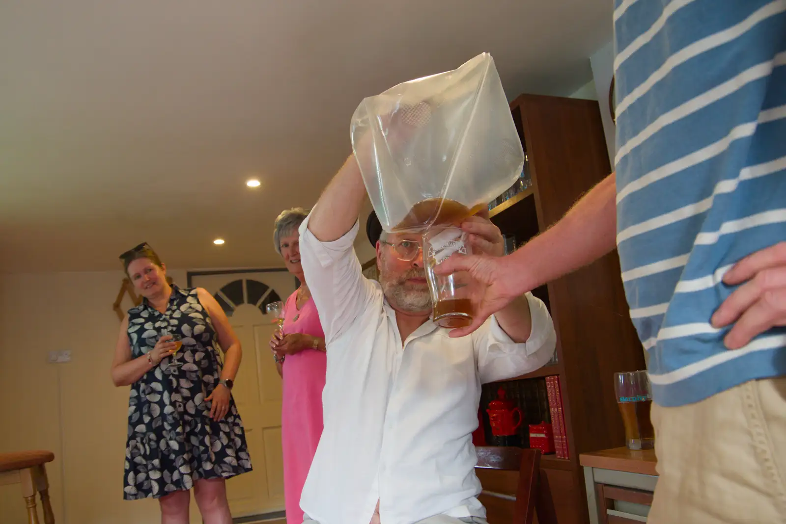 Marc squeezes out the last beer from the bag, from Alan's 80th Birthday, Eye, Suffolk - 8th August 2026