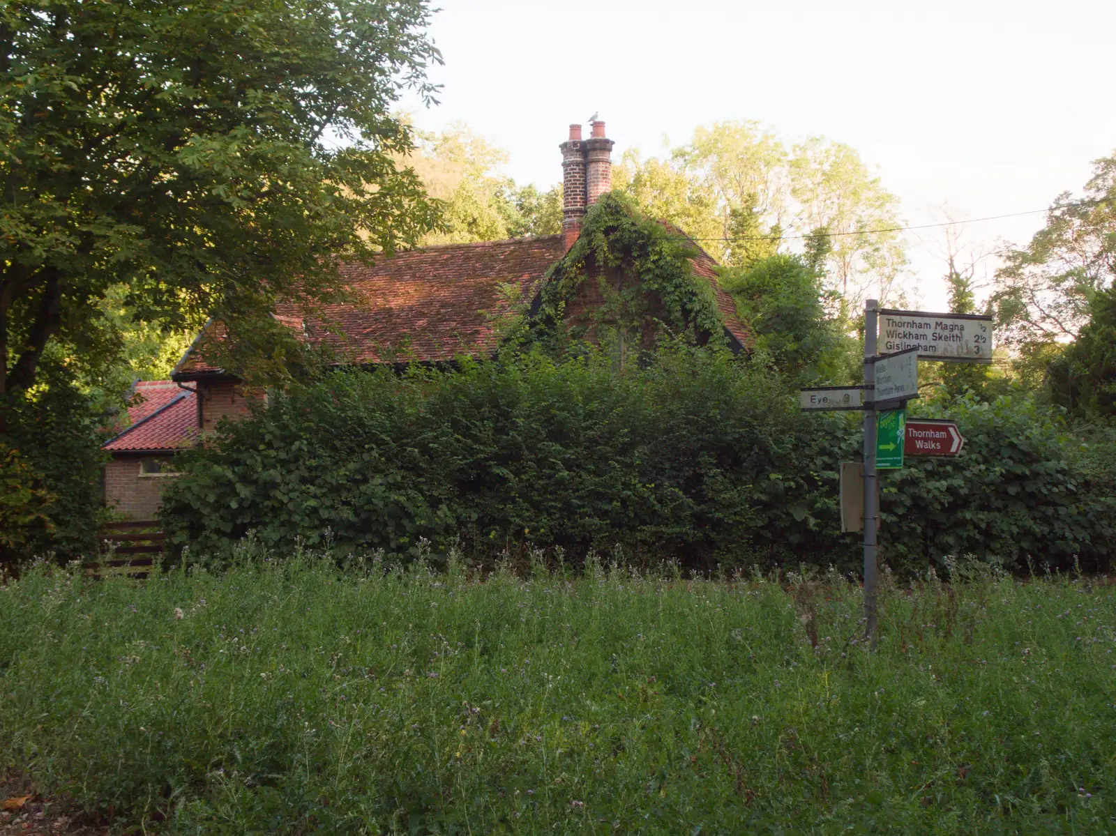 The old school house is overtaken by foliage, from A Wet Ride to the Four Horseshoes, Thornham - 19th August 2026