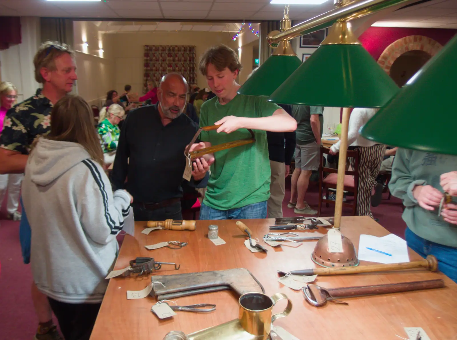 Oak tries out an antique bird hanger, from A Village Hall Quiz and a Dead Pub, Worlingworth - 21st August 2026