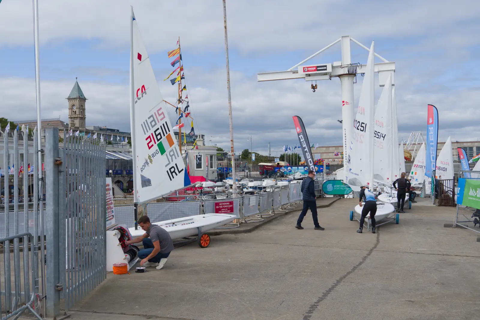The men's ILCA 7s are in town for racing, from The Ukulele Hooley, People's Park, Dún Laoghaire, Ireland - 22nd August 2026