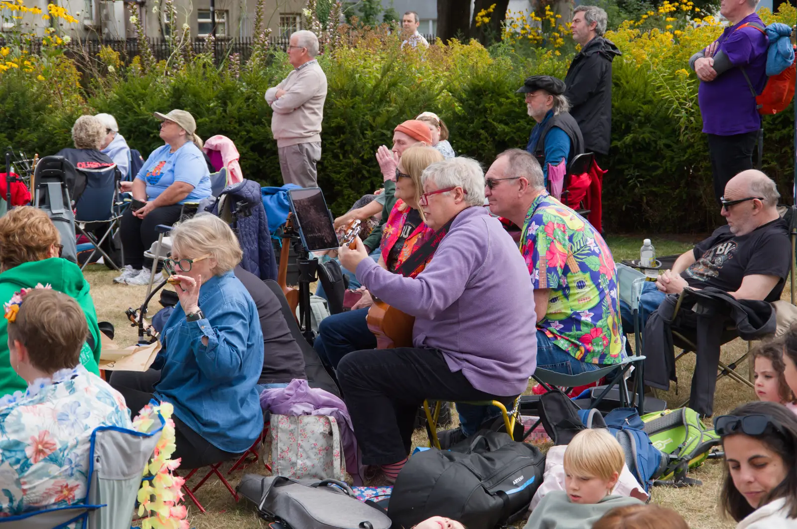 Some of the audience strums along, from The Ukulele Hooley, People's Park, Dún Laoghaire, Ireland - 22nd August 2026