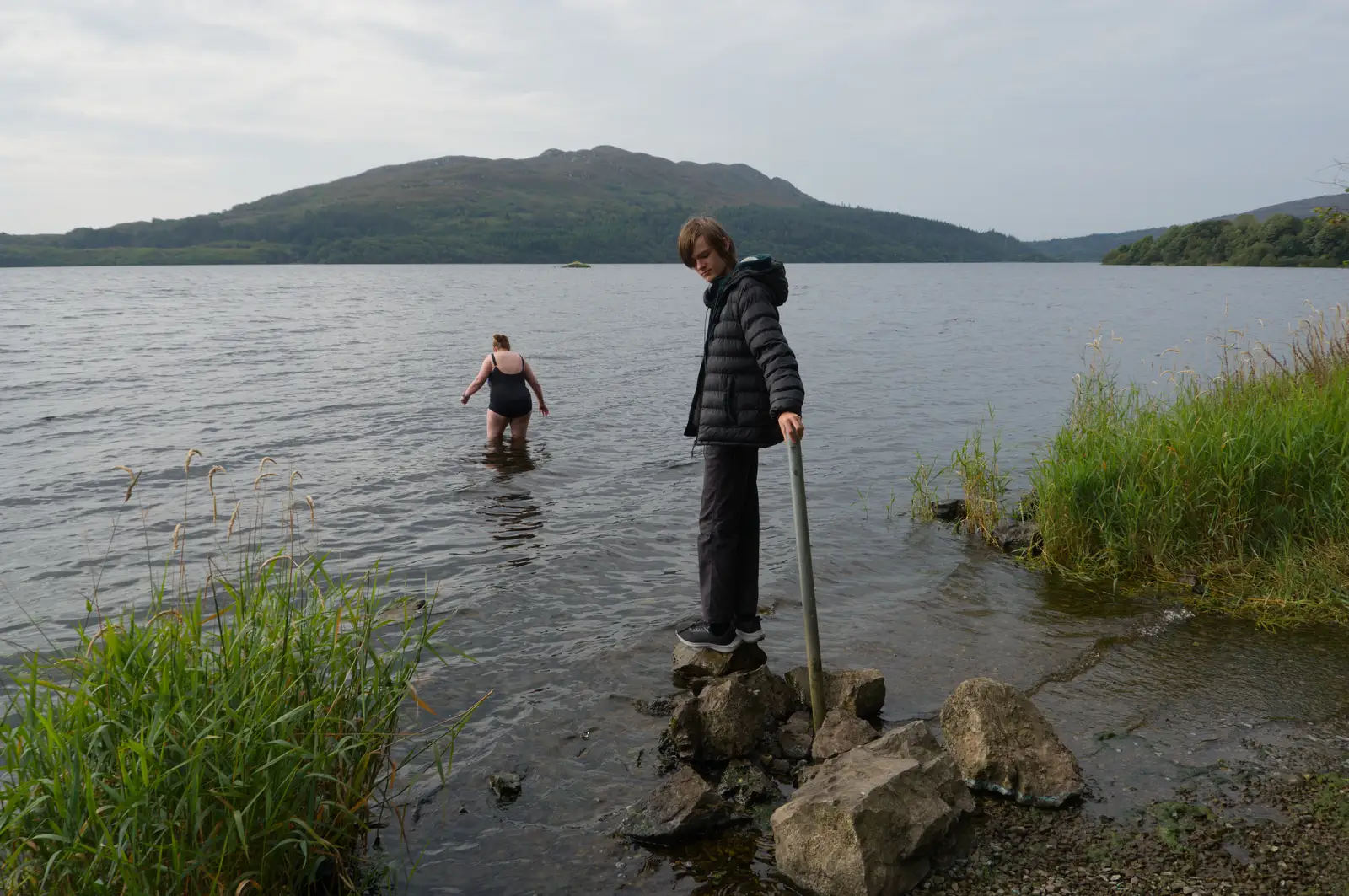 Isobel heads into the lough for a quick swim, from Clogherrevagh and Strandhill, Leitrim, Ireland - 24th August 2026
