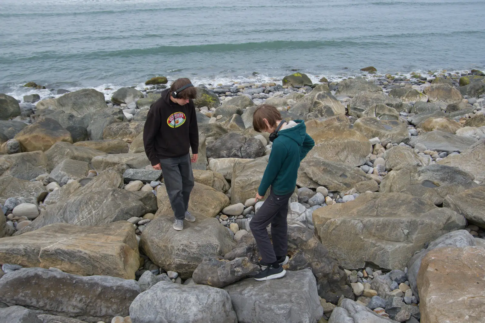 The boys poke around in the rocks, from Clogherrevagh and Strandhill, Leitrim, Ireland - 24th August 2026