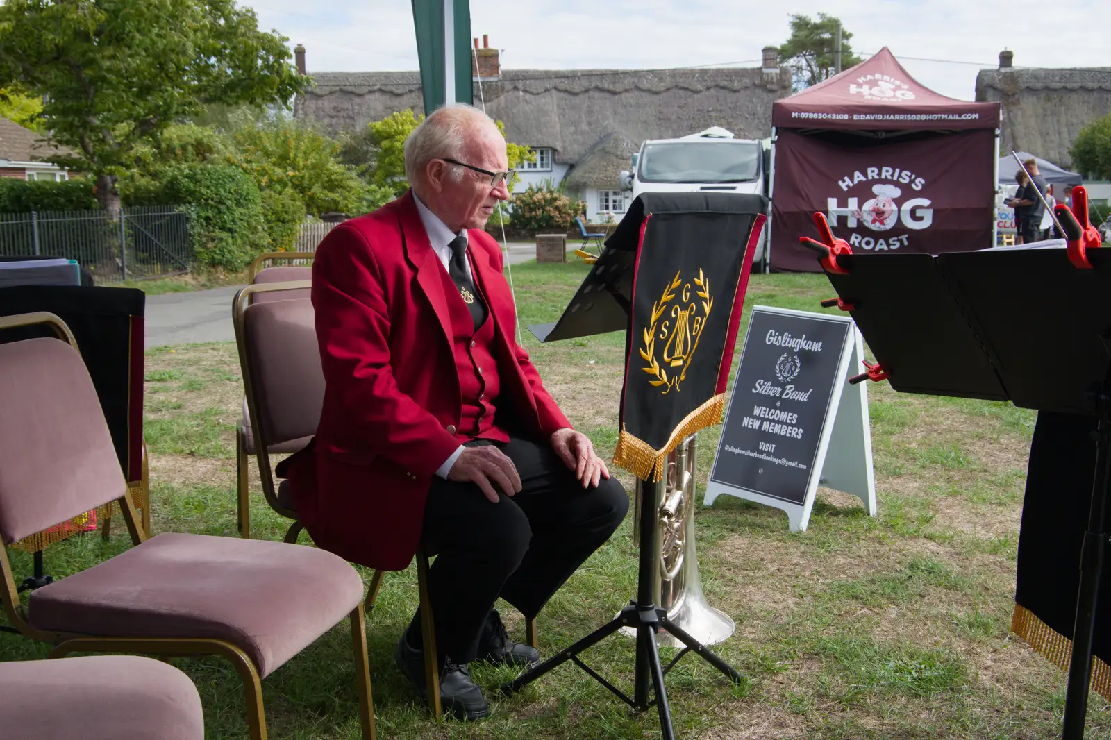 Kenny considers his euphonium, from The GSB at the Carnival, Pulham Market, Norfolk - 12th September 2026