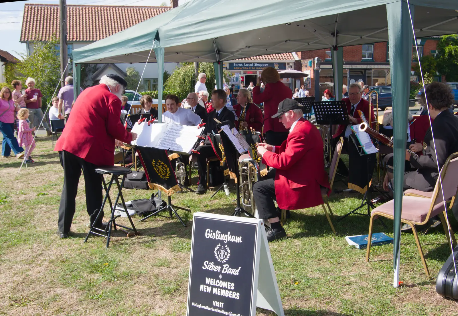 Adrian wrangles his score in the wind, from The GSB at the Carnival, Pulham Market, Norfolk - 12th September 2026