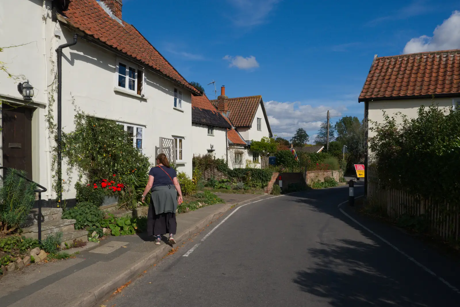 Isobel walks up Cross Green, from A Walk Around The Lion Pub, Debenham, Suffolk - 4th October 2026