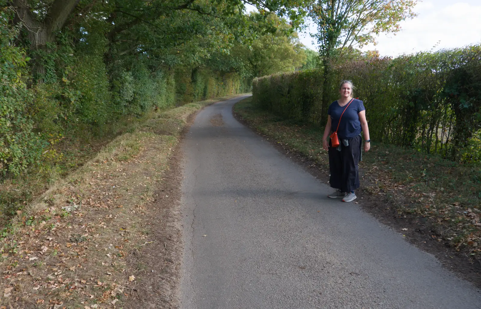 Isobel stops to look back, from A Walk Around The Lion Pub, Debenham, Suffolk - 4th October 2026